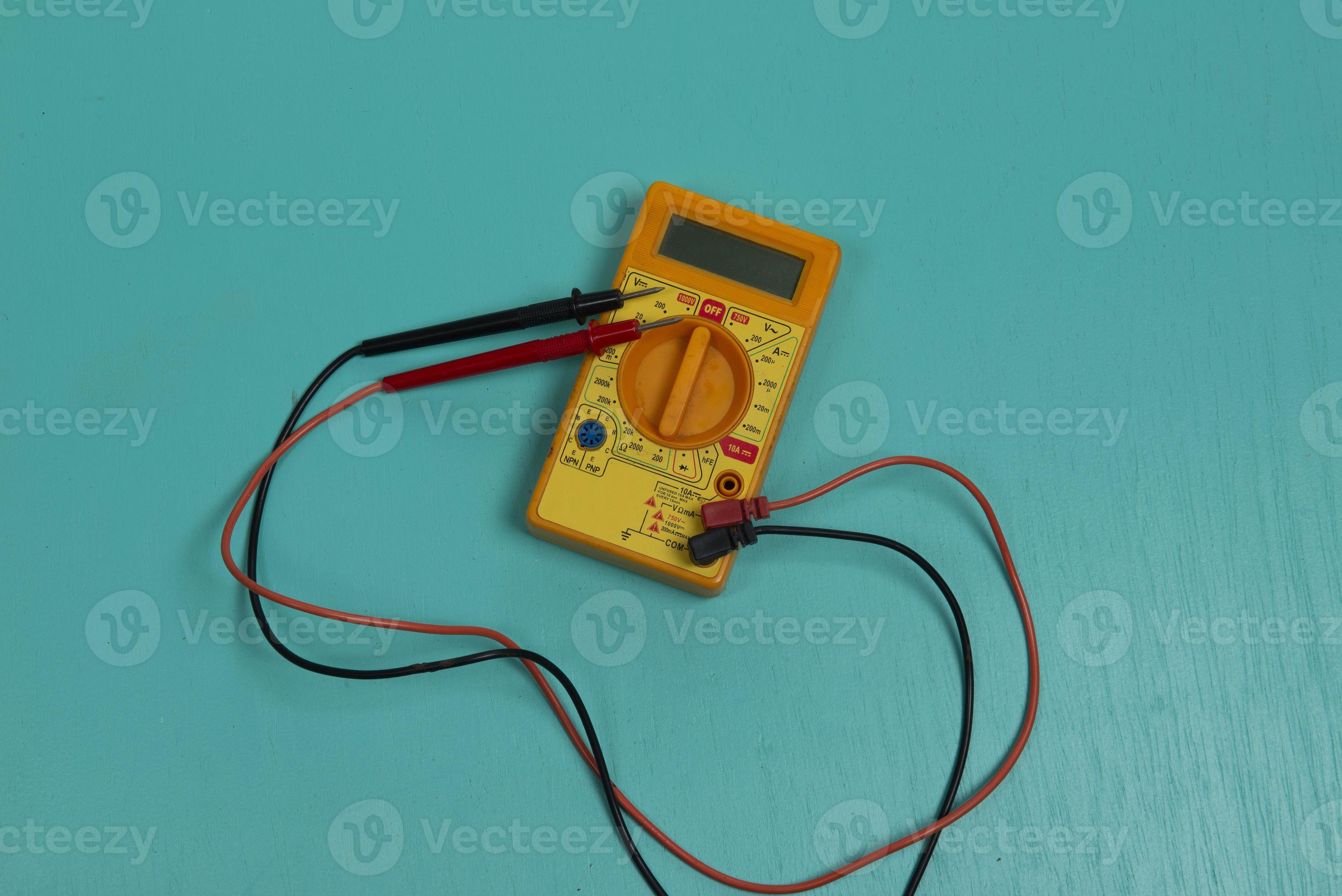 Multitester is an electric measuring instrument. 12573578 Stock Photo at Vecteezy