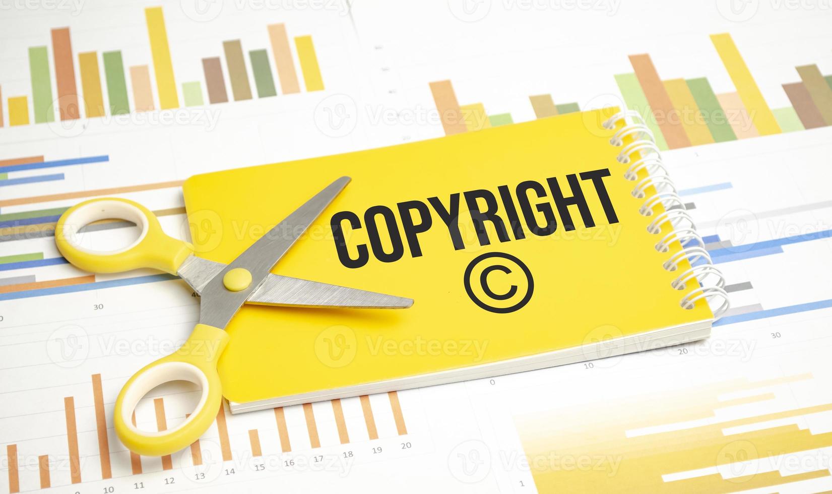 Text word Copyright on yellow paper and charts photo