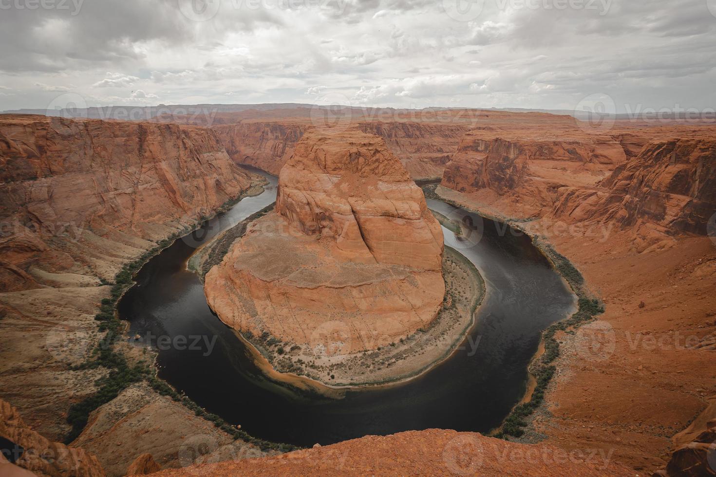 Wide angle landscape shot of Horseshoe Bend at the tip of the Grand Canyon on a cloudy day near Page, Arizona photo