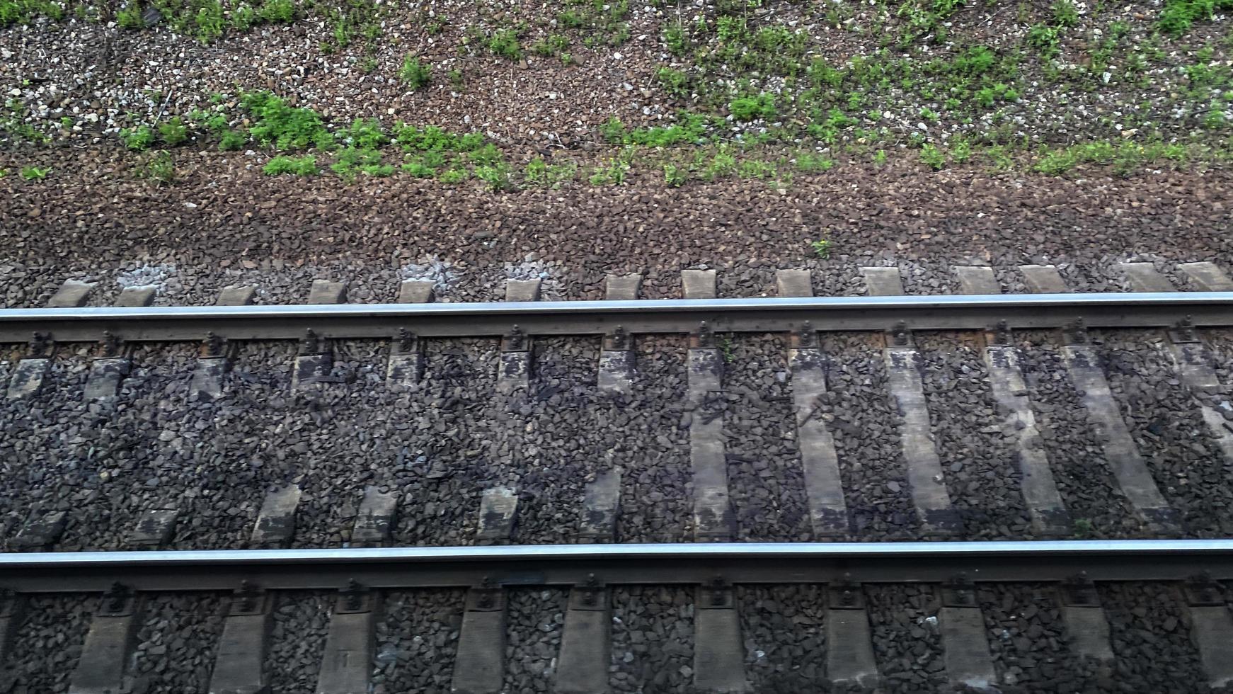 Landscape with a view of the rails and sleepers of the railway photo
