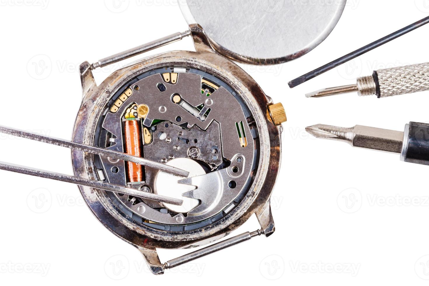 top view of replacing battery in quartz watch photo