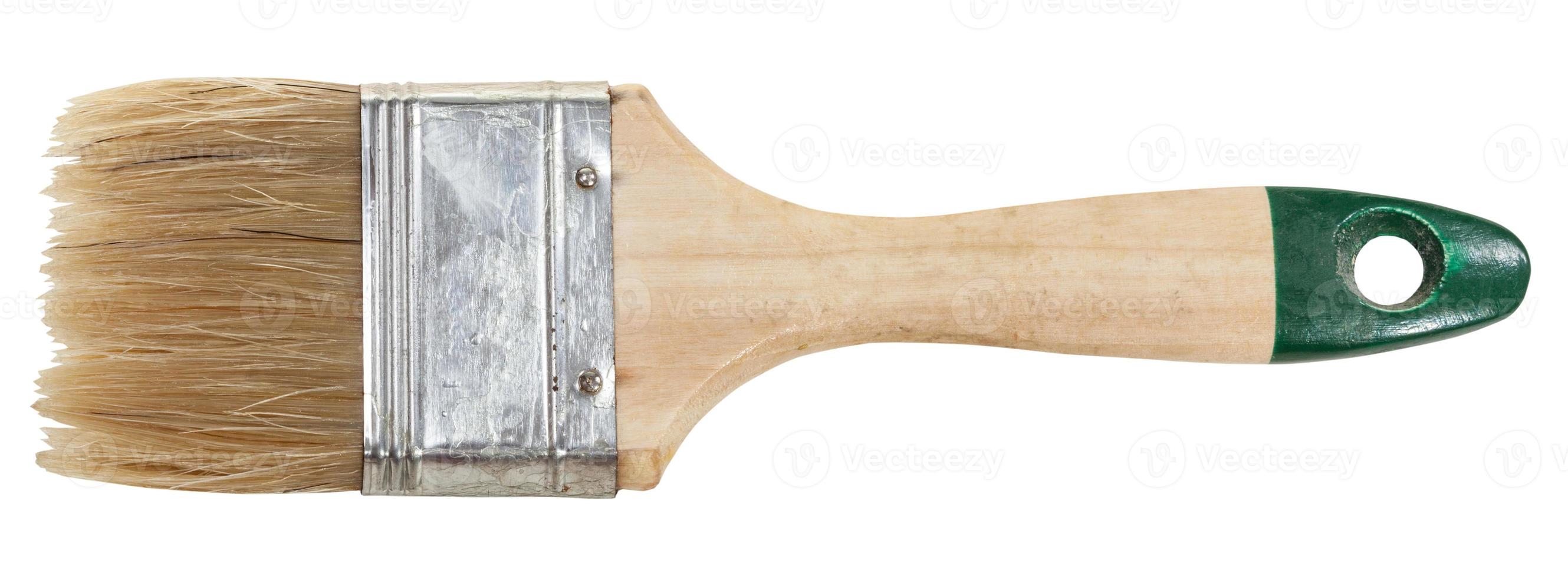 flat paintbrush with wet tip isolated on white photo