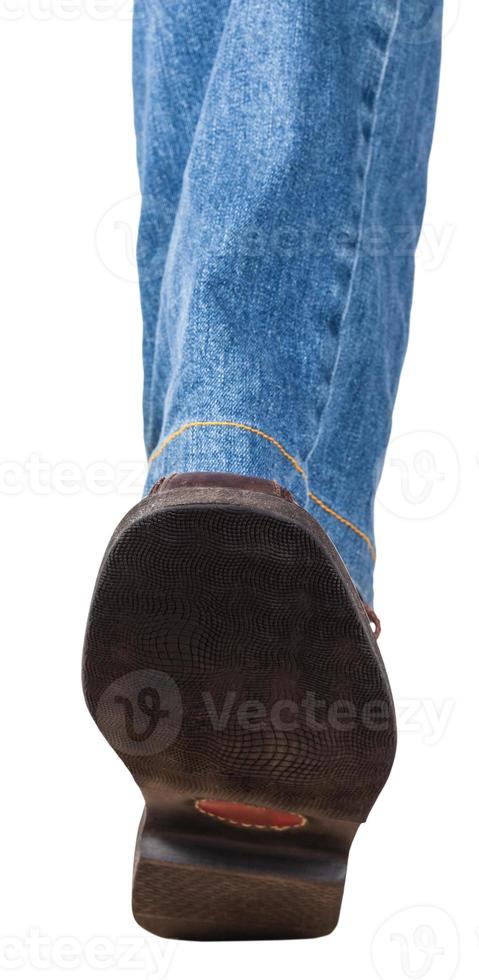 direct view of left leg in jeans and brown shoe photo