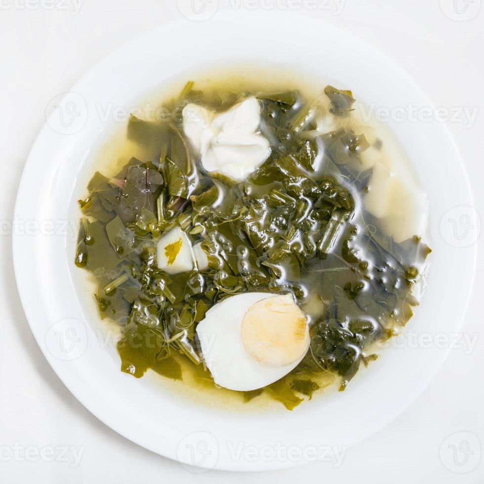 above view of vegetarian soup in plate from greens photo