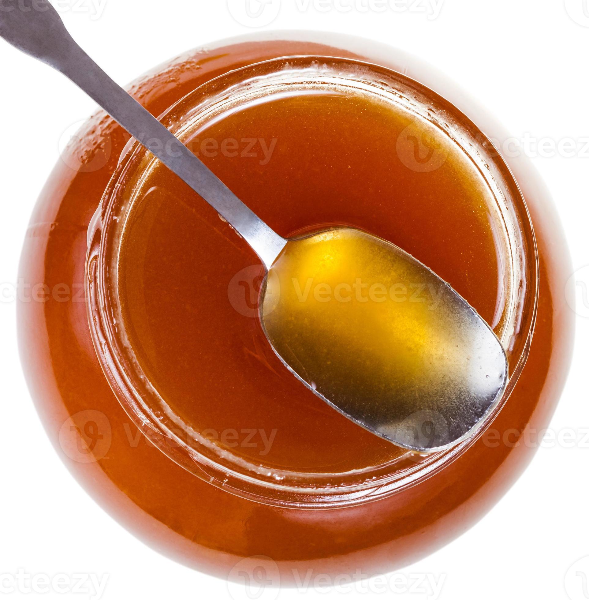 above view of steel spoon on glass jar with honey 12575802 Stock Photo