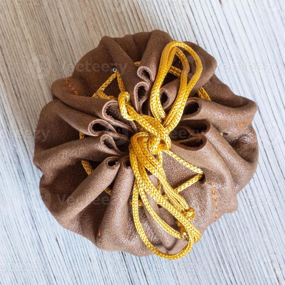 top view of tied leather purse for jewelry photo