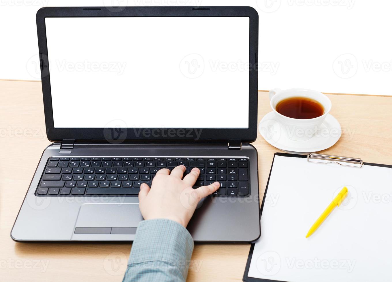 laptop with isolated screen on office table photo