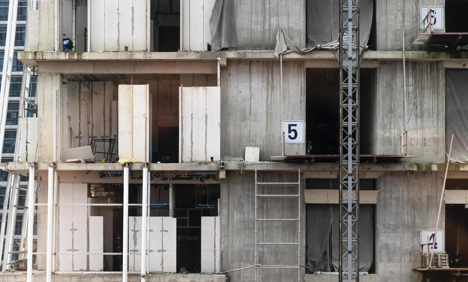 Building construction site with steel scaffold photo