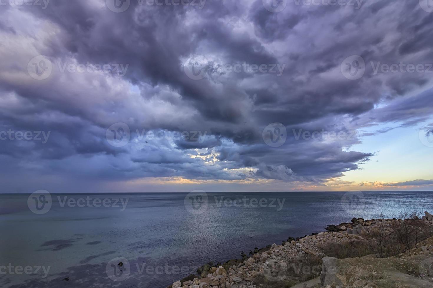 Exciting calm seascape with stormy clouds photo
