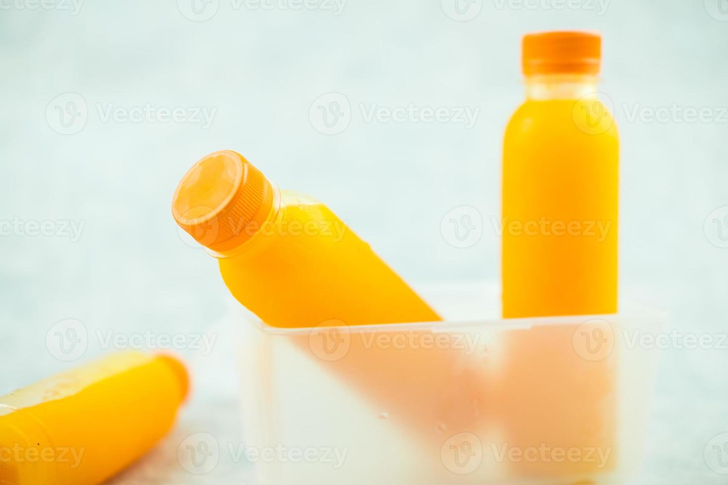 Fresh orange juice in no label clear plastic bottle. 12576549 Stock