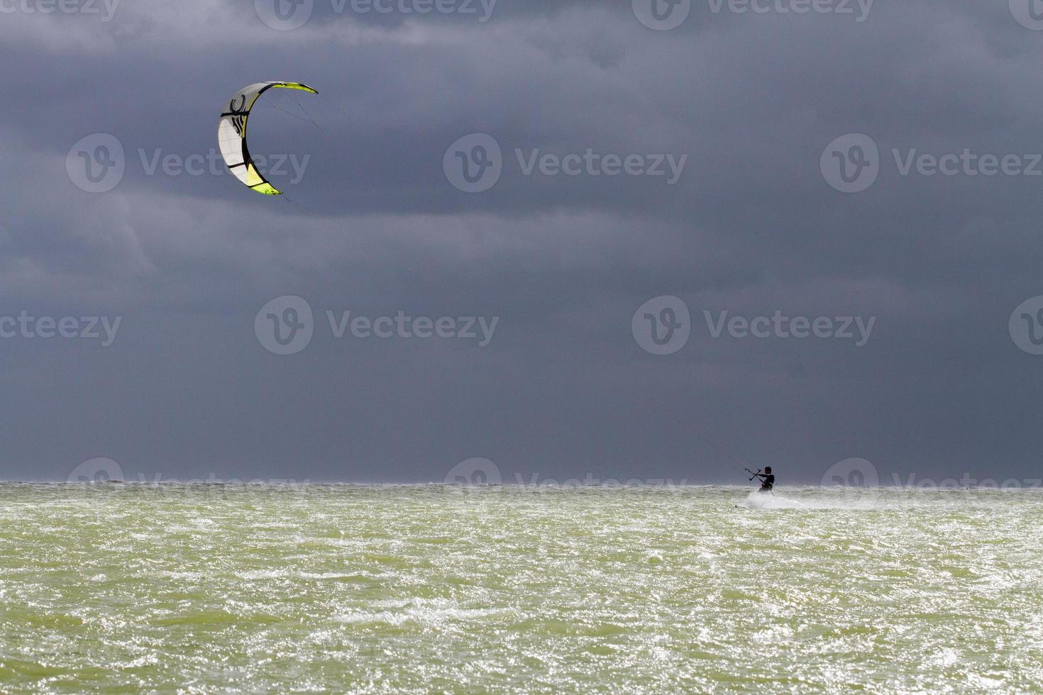 Man kitesurfing in the Netherlands photo