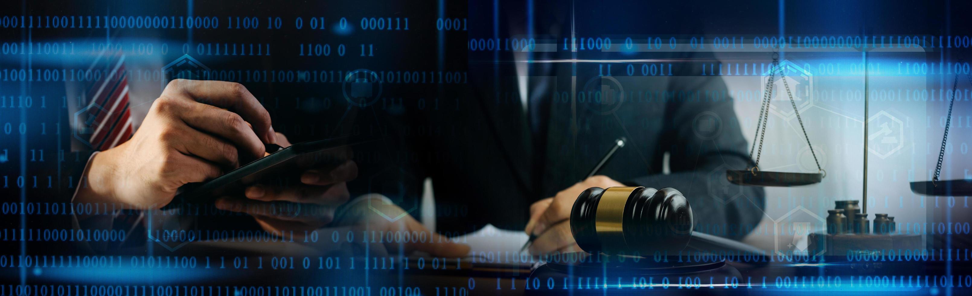 Justice and law concept.Male judge in a courtroom with the gavel, working with, computer and docking keyboard, eyeglasses, on table in morning light photo