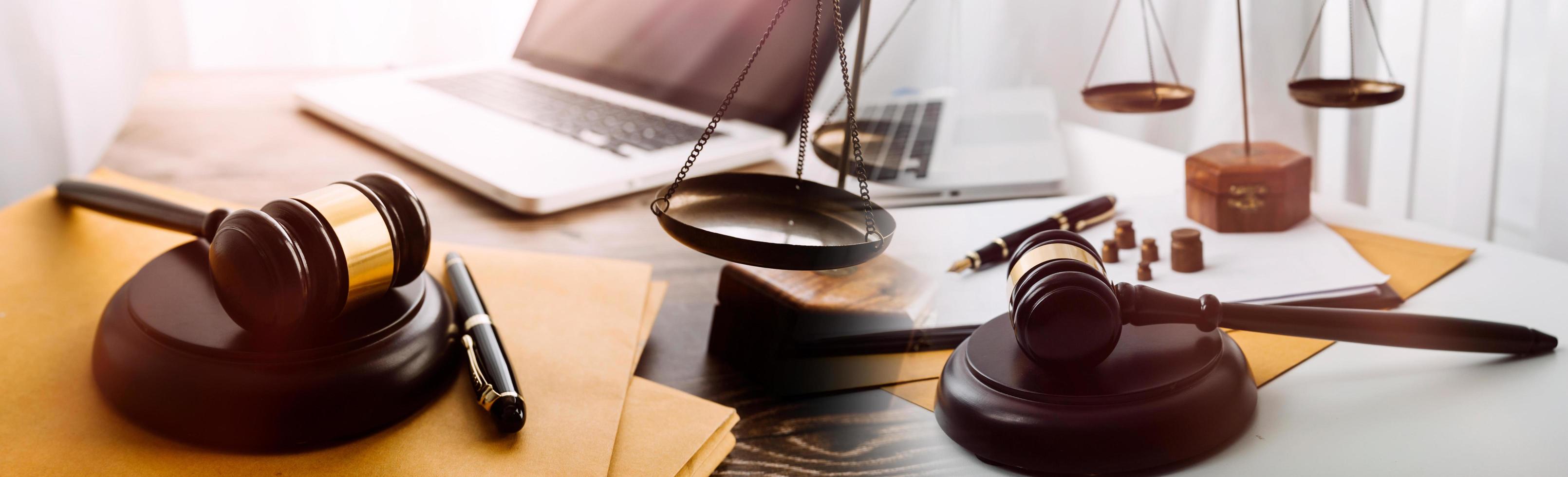 Business and lawyers discussing contract papers with brass scale on desk in office. Law, legal services, advice, justice and law concept picture with film grain effect photo