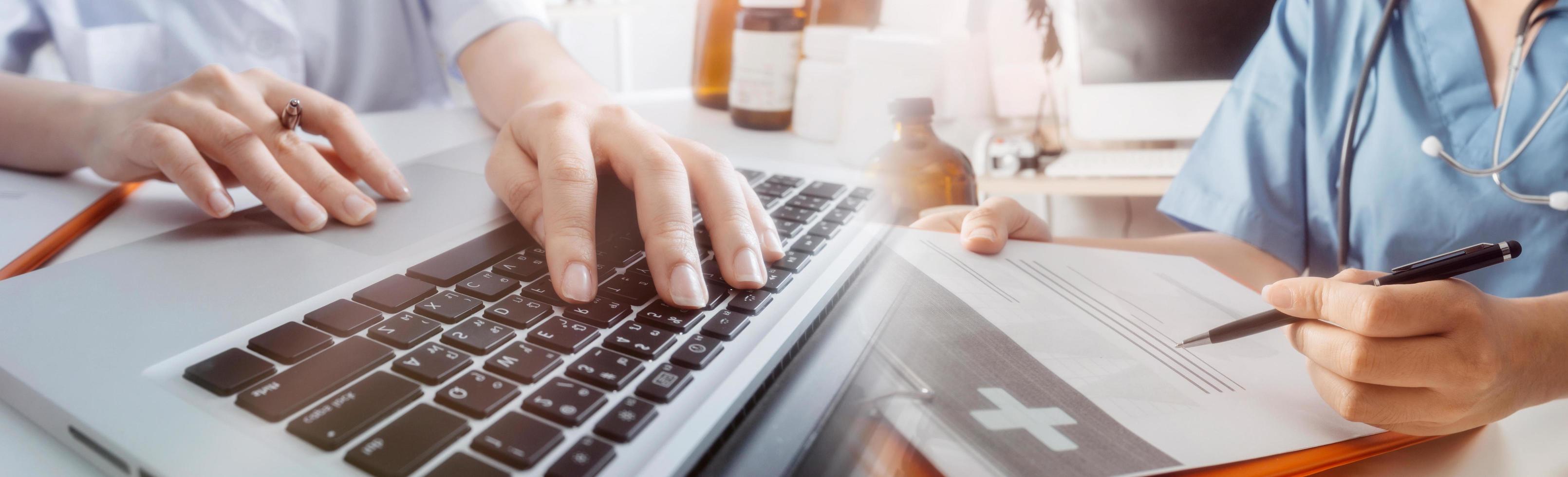 Medicine doctor hand working on a patients x-ray scans digital healthcare and connection with modern virtual screen interface icons, Medical technology and network concept. photo