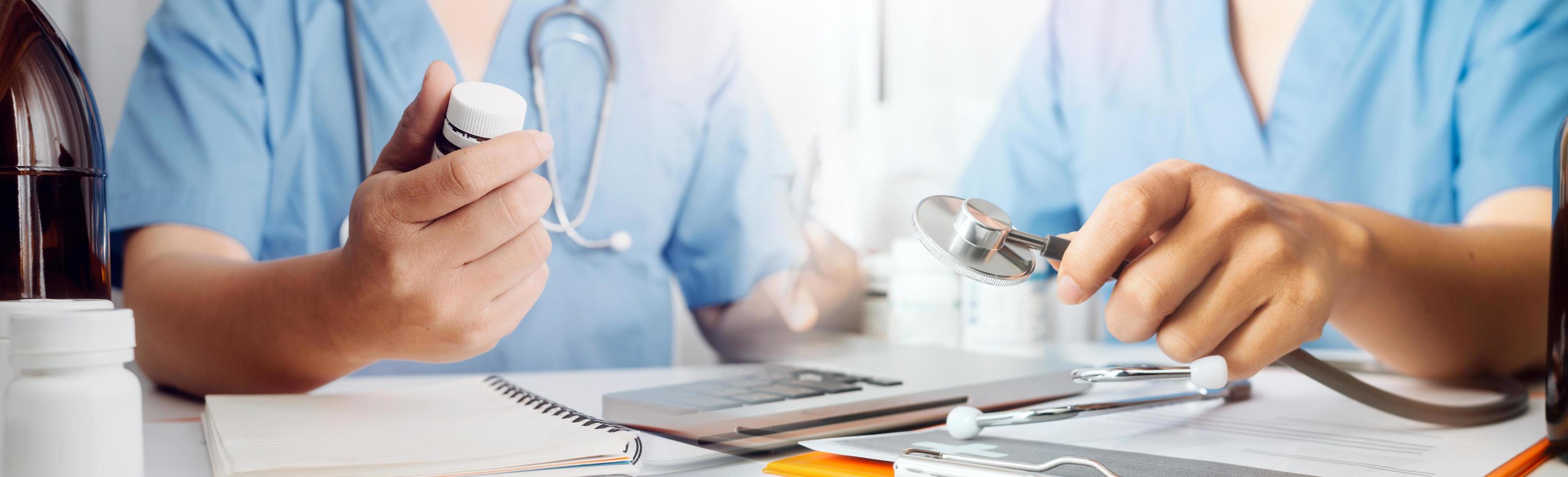 Medicine doctor hand working on a patients x-ray scans digital healthcare and connection with modern virtual screen interface icons, Medical technology and network concept. photo