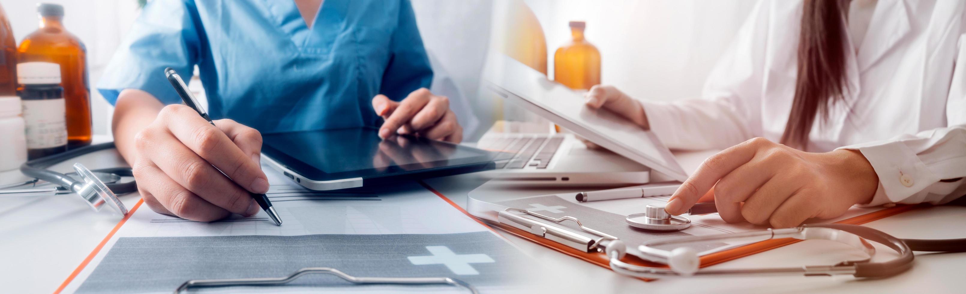 Medicine doctor hand working on a patients x-ray scans digital healthcare and connection with modern virtual screen interface icons, Medical technology and network concept. photo