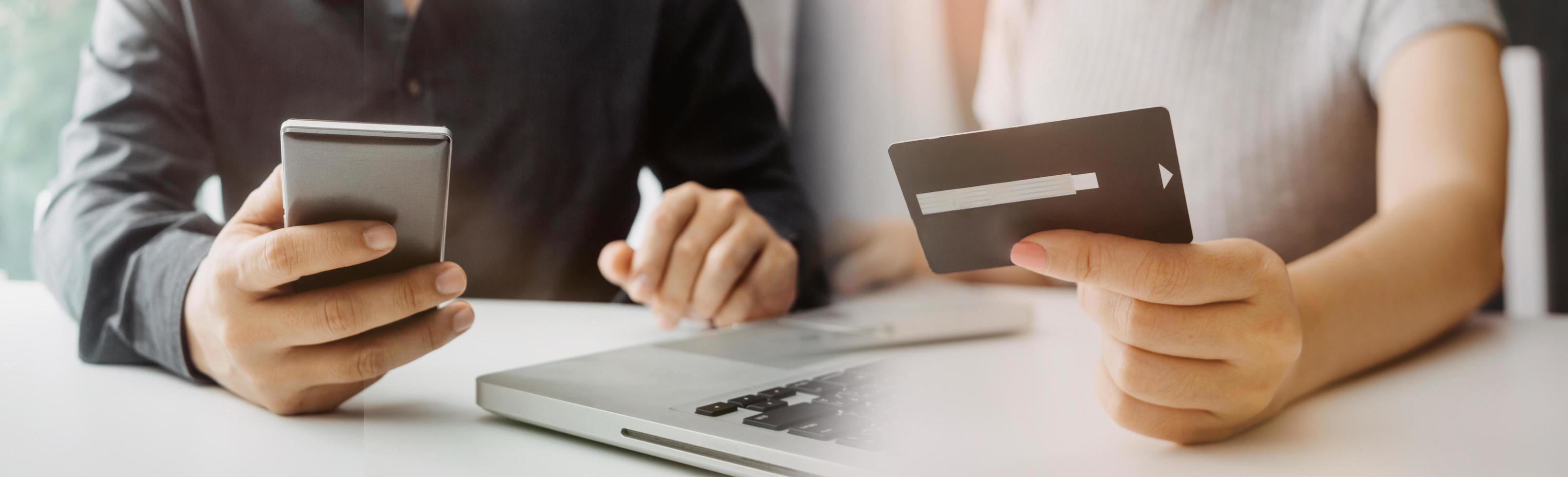 technology, people and online shopping concept - happy smiling man with tablet pc computer and credit card at home photo