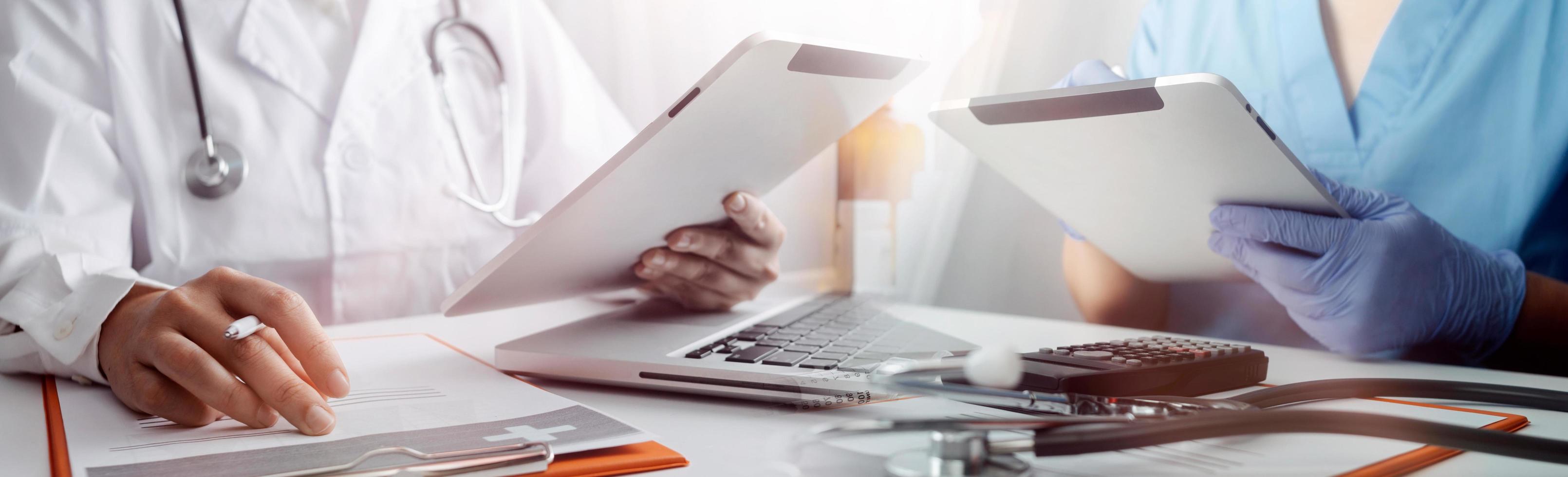 Medicine doctor hand working on a patients x-ray scans digital healthcare and connection with modern virtual screen interface icons, Medical technology and network concept. photo