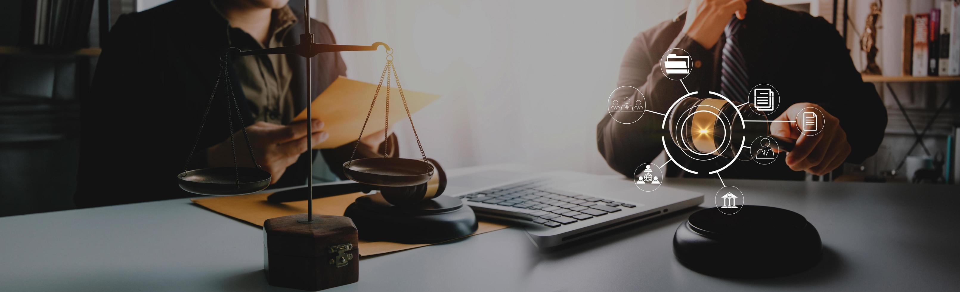 Business and lawyers discussing contract papers with brass scale on desk in office. Law, legal services, advice, justice and law concept picture with film grain effect photo