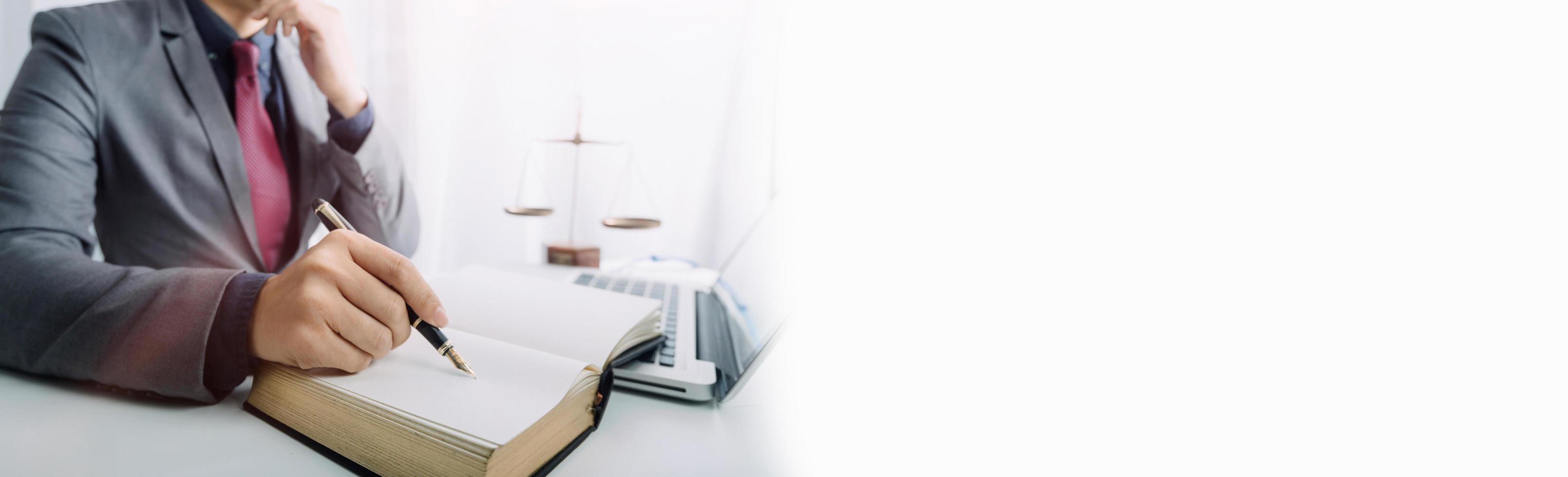 Business and lawyers discussing contract papers with brass scale on desk in office. Law, legal services, advice, justice and law concept picture with film grain effect photo