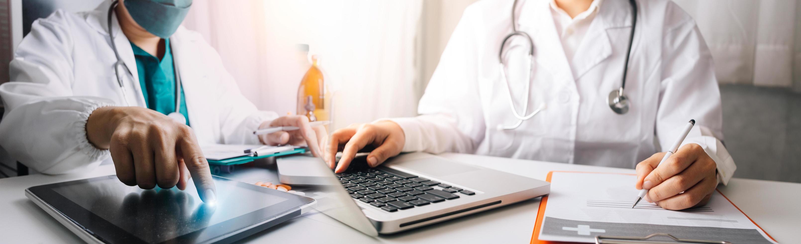 Medicine doctor hand working on a patients x-ray scans digital healthcare and connection with modern virtual screen interface icons, Medical technology and network concept. photo