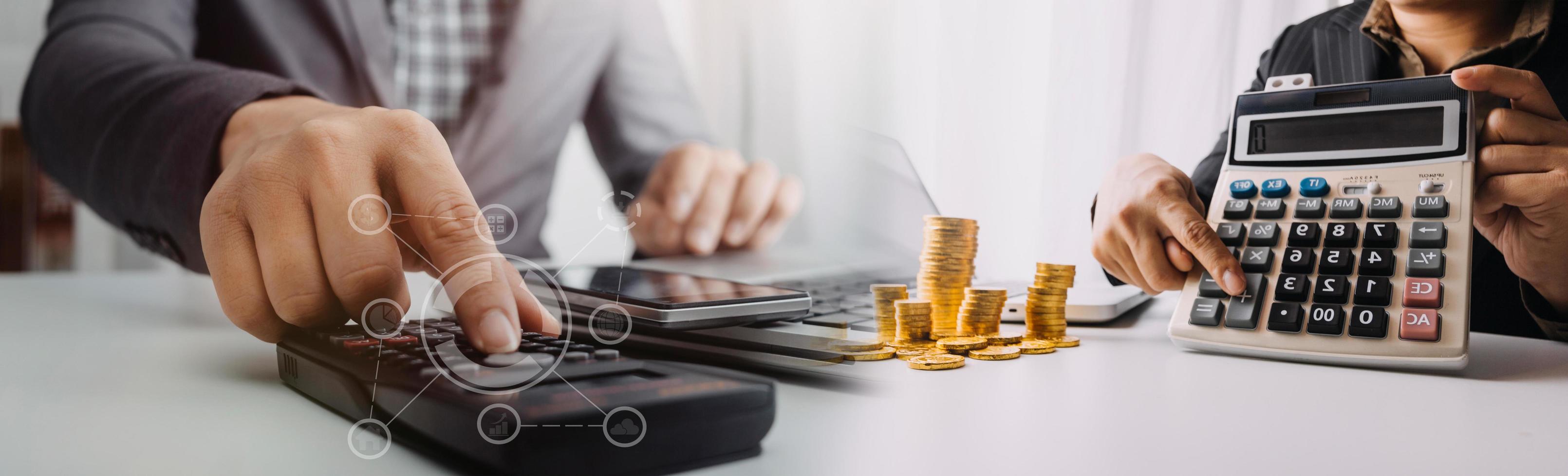 Business accounting concept, Business man using calculator with computer laptop, budget and loan paper in office. photo