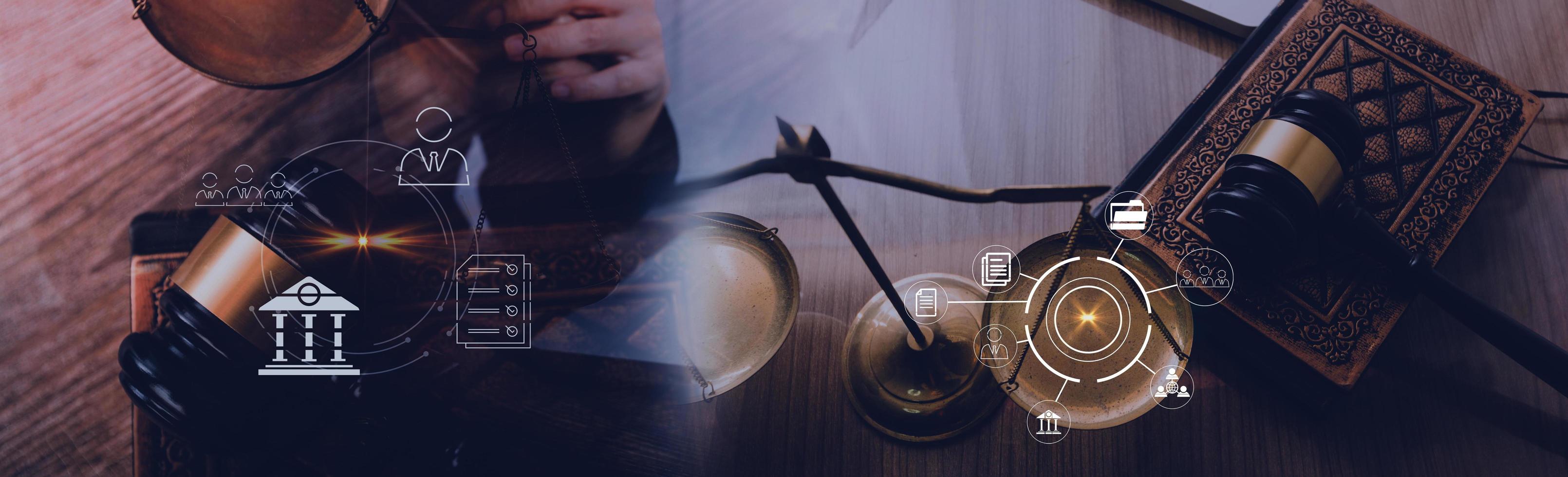 Justice and law concept.Male judge in a courtroom with the gavel, working with, computer and docking keyboard, eyeglasses, on table in morning light photo