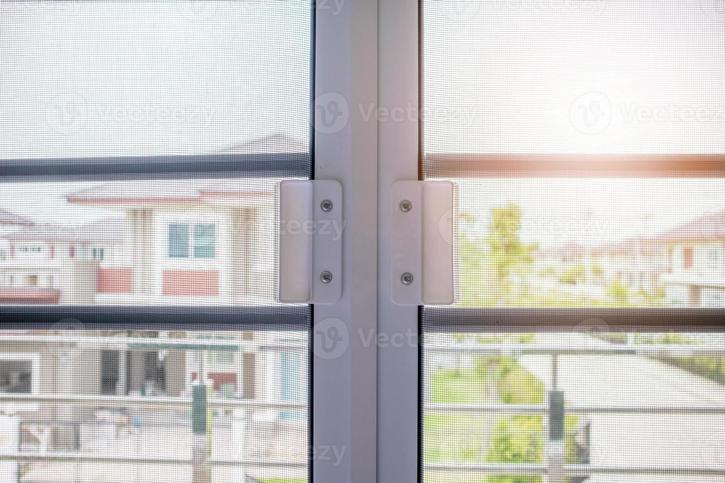 mosquito net wire screen on house window protection against insect photo