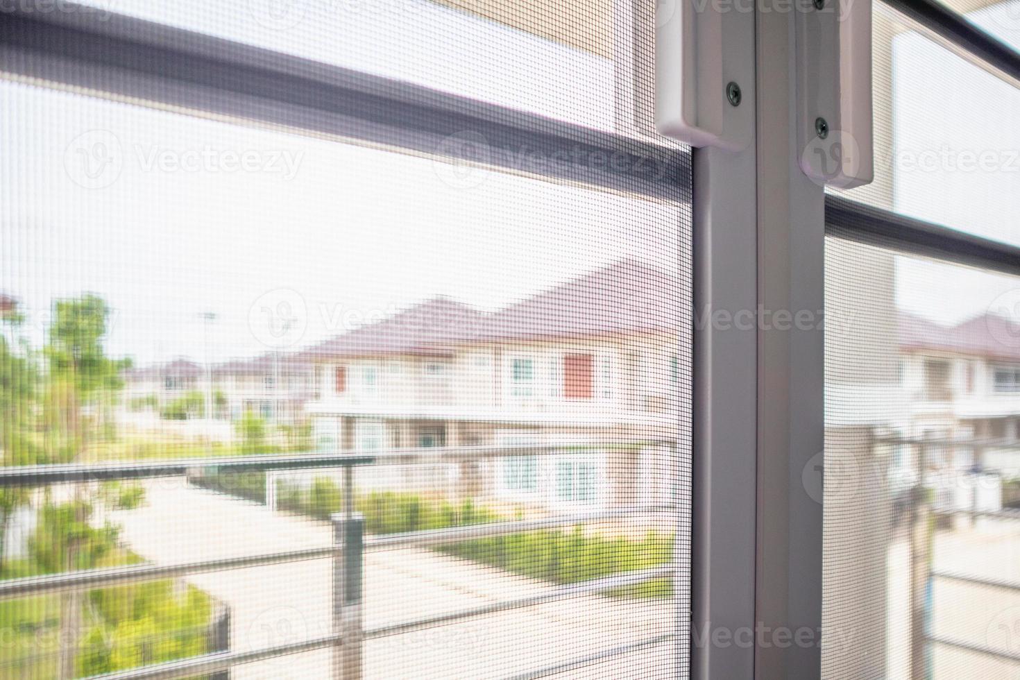 mosquito net wire screen on house window protection against insect photo