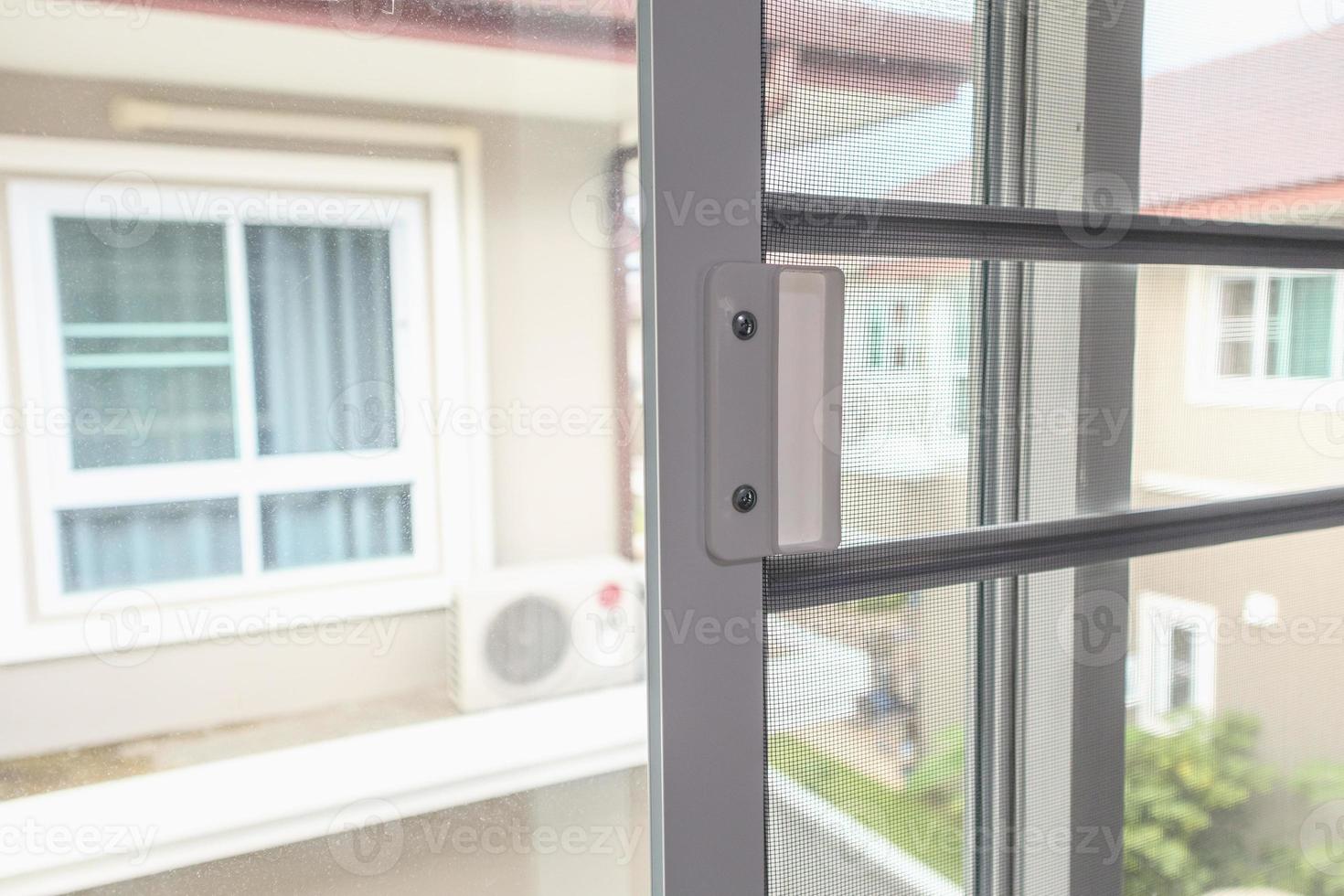 mosquito net wire screen on house window protection against insect photo