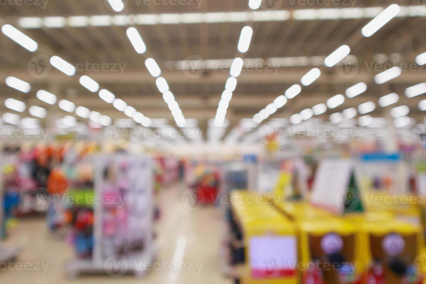 Abstract blur supermarket discount store product shelves interior defocused background photo