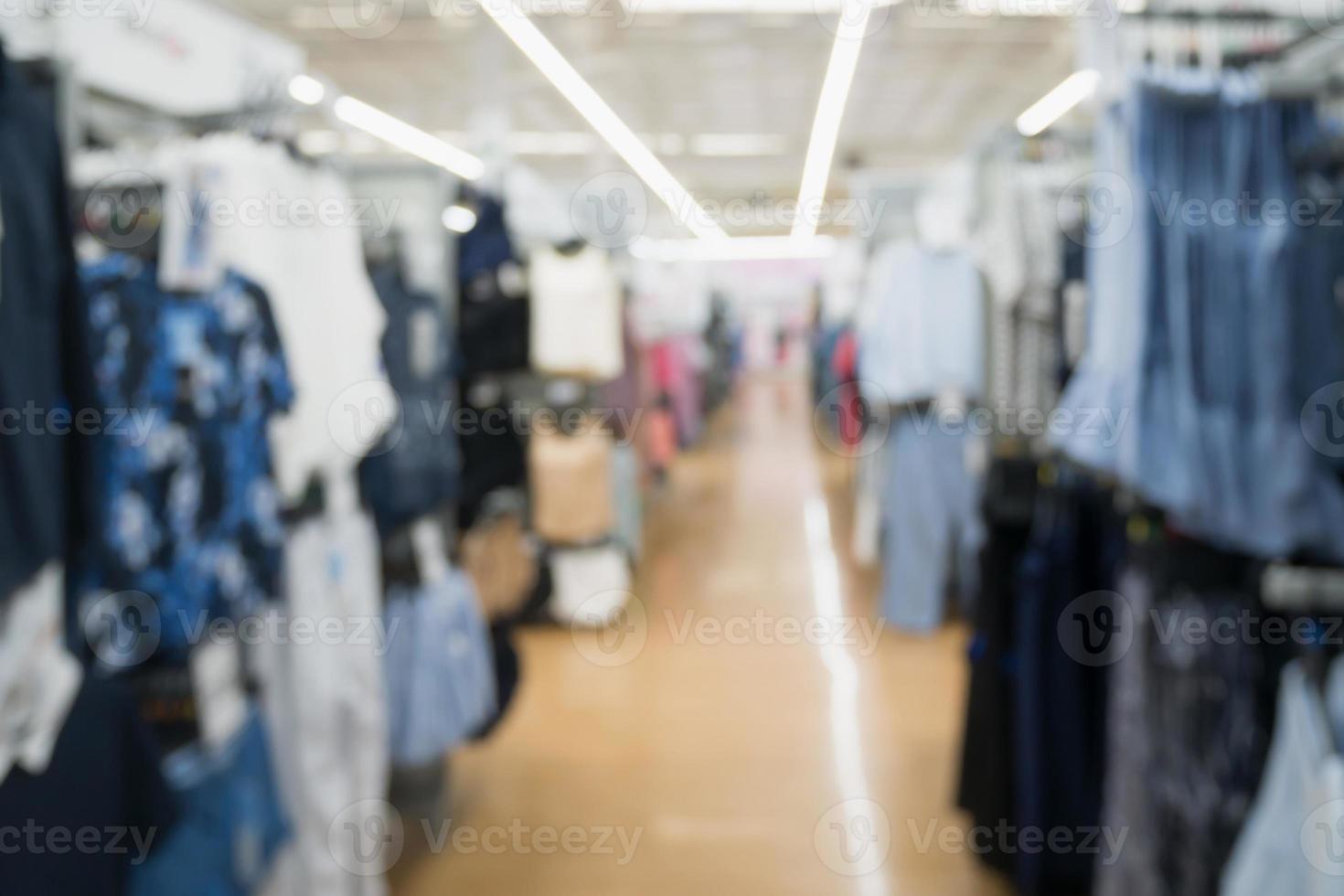 Abstract blurred fashion clothing store in modern shopping mall background photo