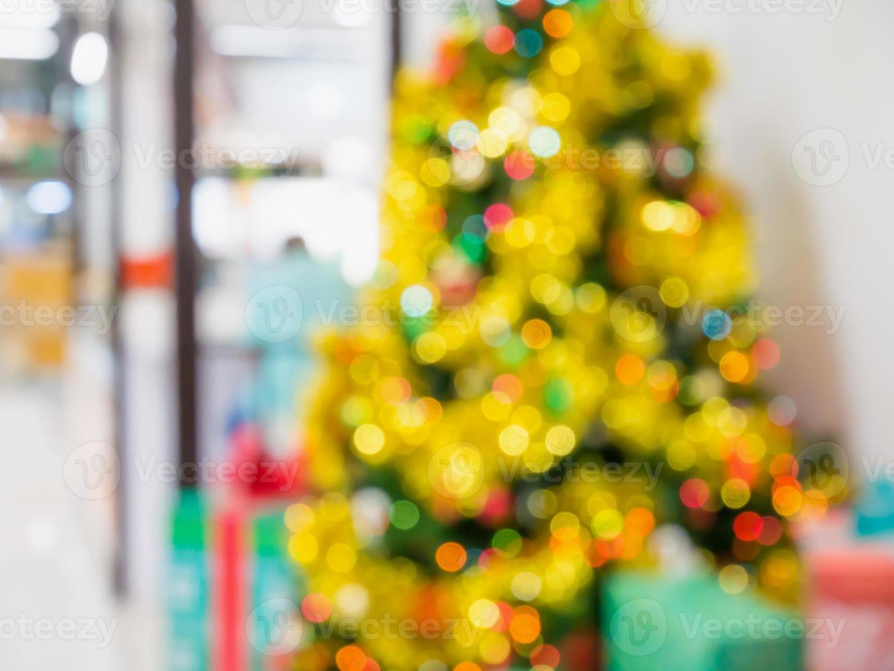 Christmas tree decorated with lights abstract blur background with bokeh photo