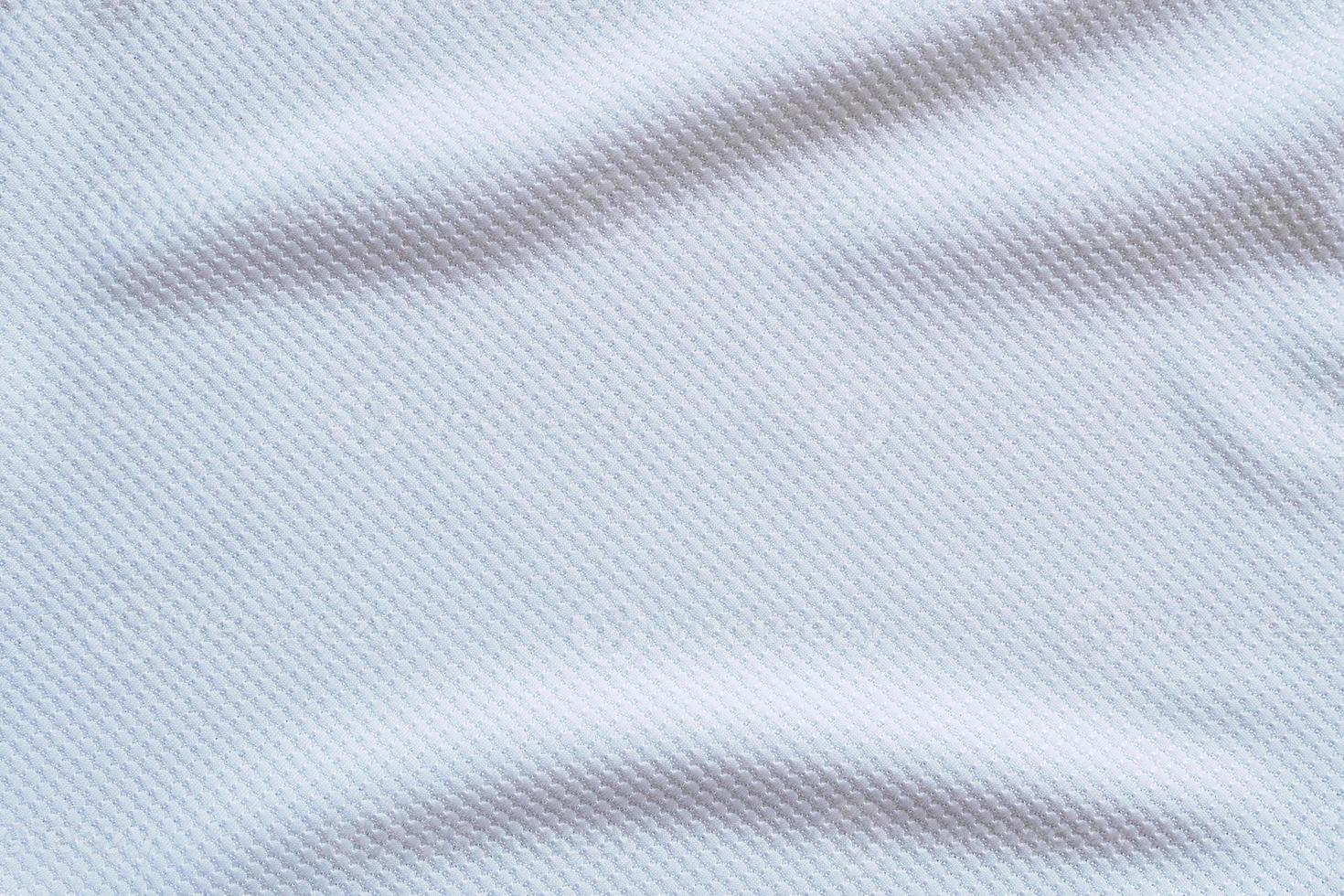 fondo de ropa deportiva de textura de tela de ropa de camiseta de fútbol blanca foto