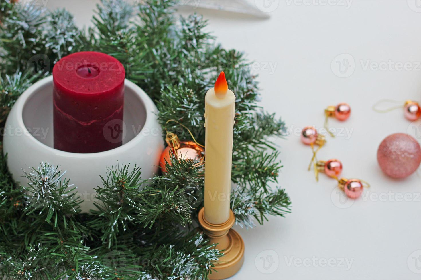 candles in candlesticks and Christmas wreath, wallpaper 12581253 Stock