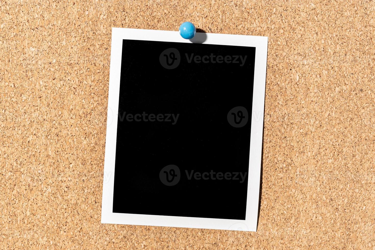 Blank Vintage instant photo frame pinned on corkboard. Template