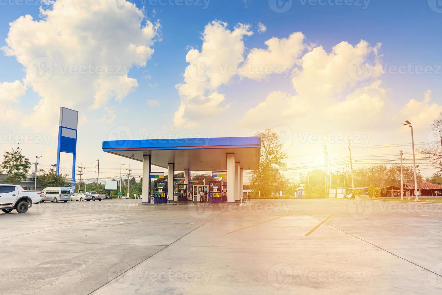 Petrol gas fuel station with clouds and blue sky photo