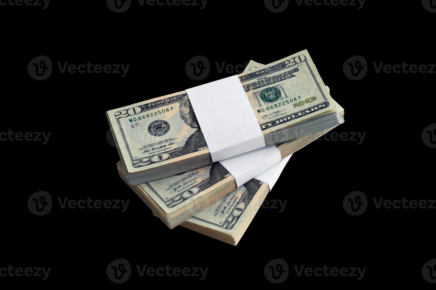 Bundle of US dollar bills isolated on black. Pack of american money with high resolution on perfect black background photo