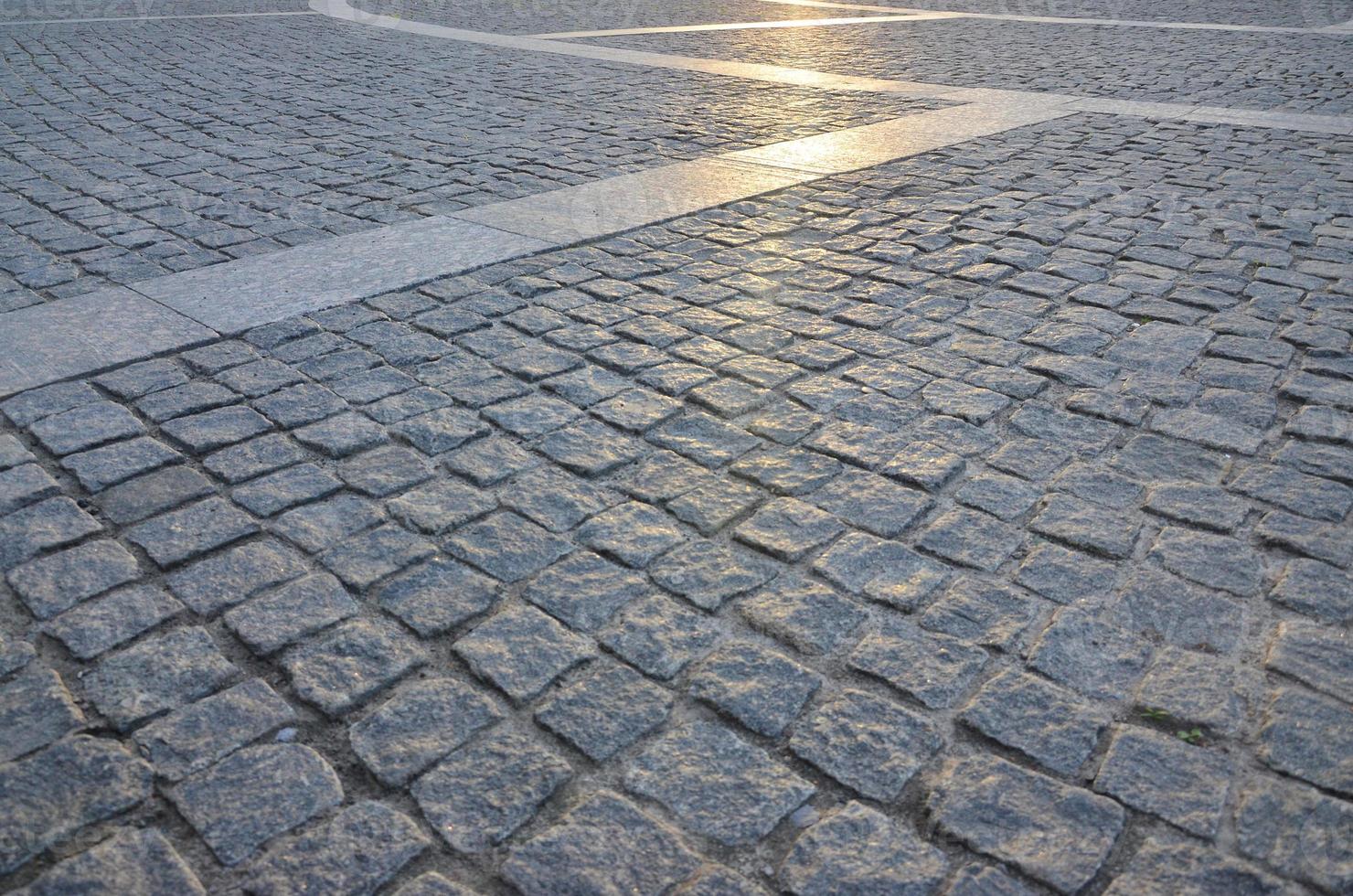 Fragment of the street square, folded out of a gray square paving stone photo