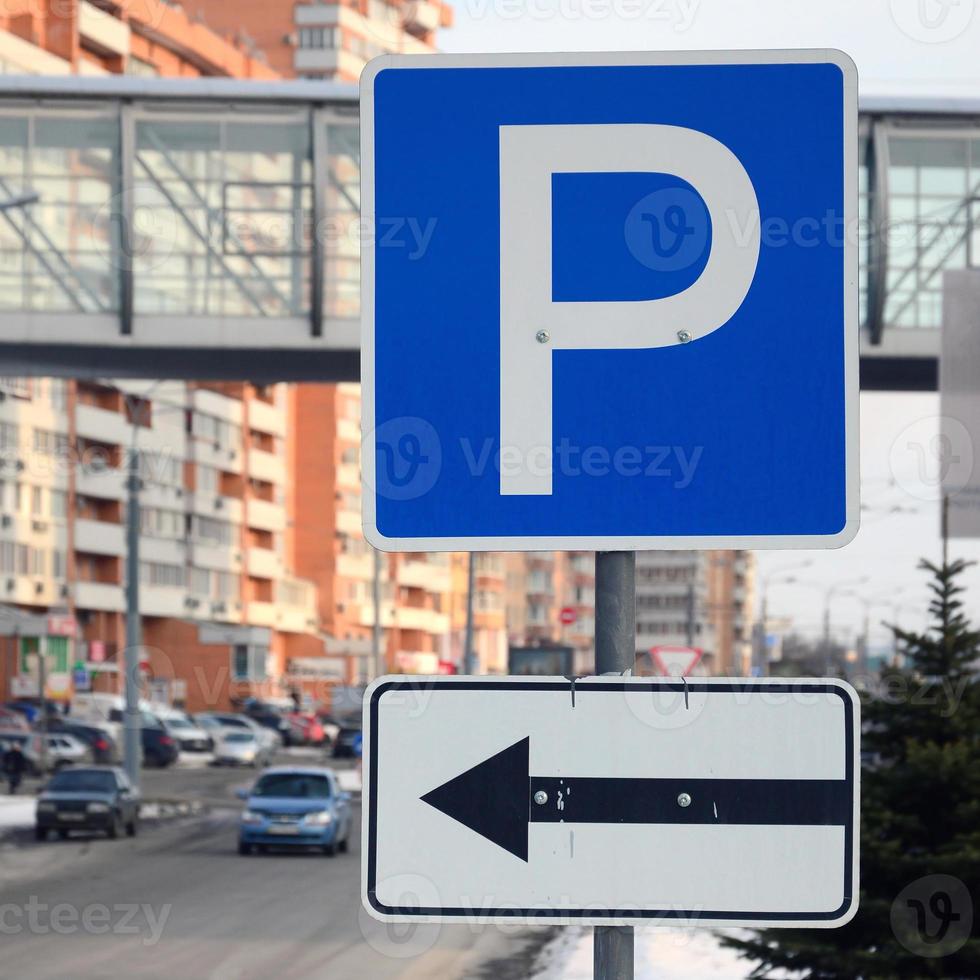 Parking left. Traffic sign with the letter P and the arrows to the left photo