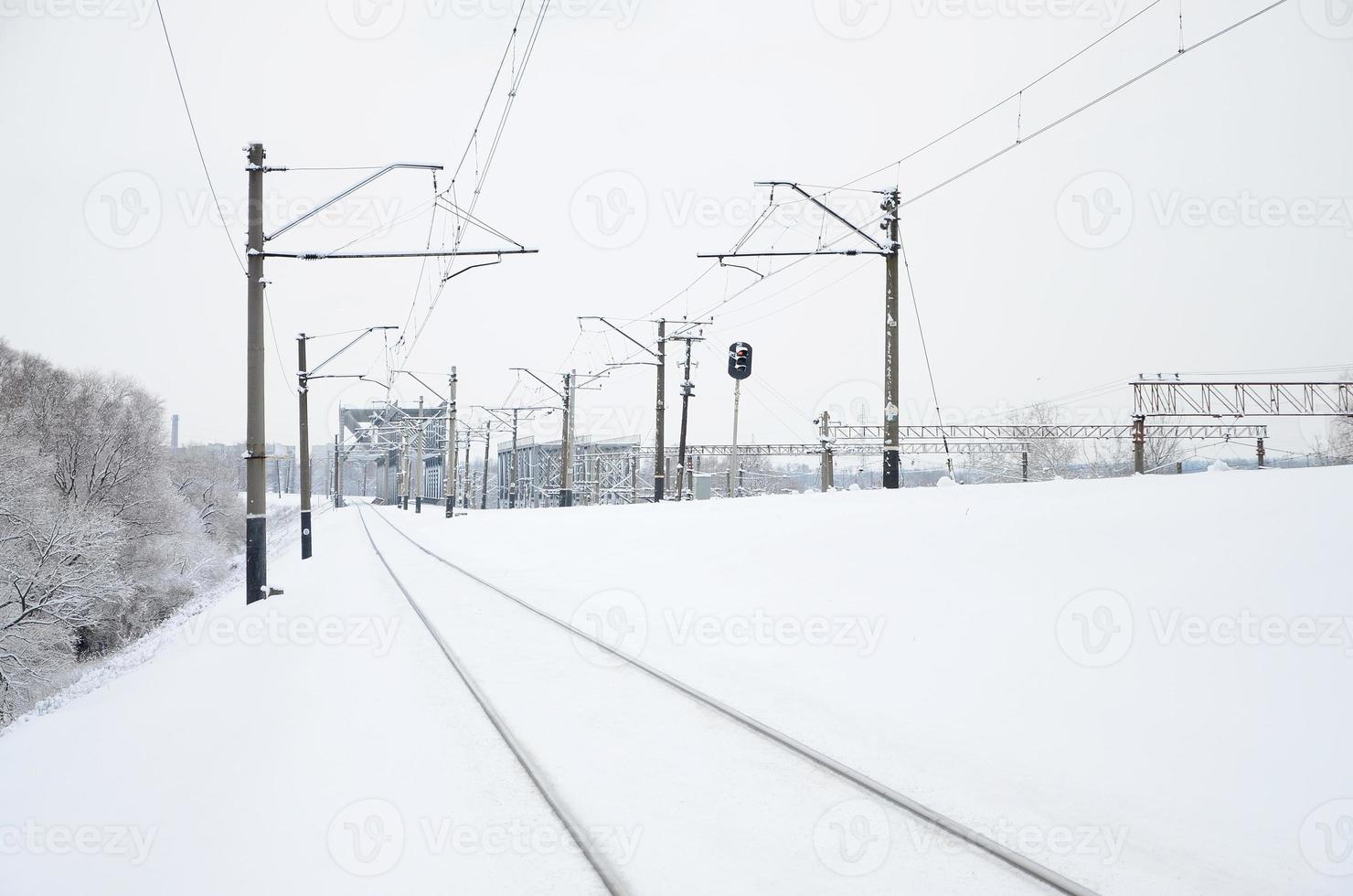 Winter railway landscape, Railway tracks in the snow-covered industrial country photo