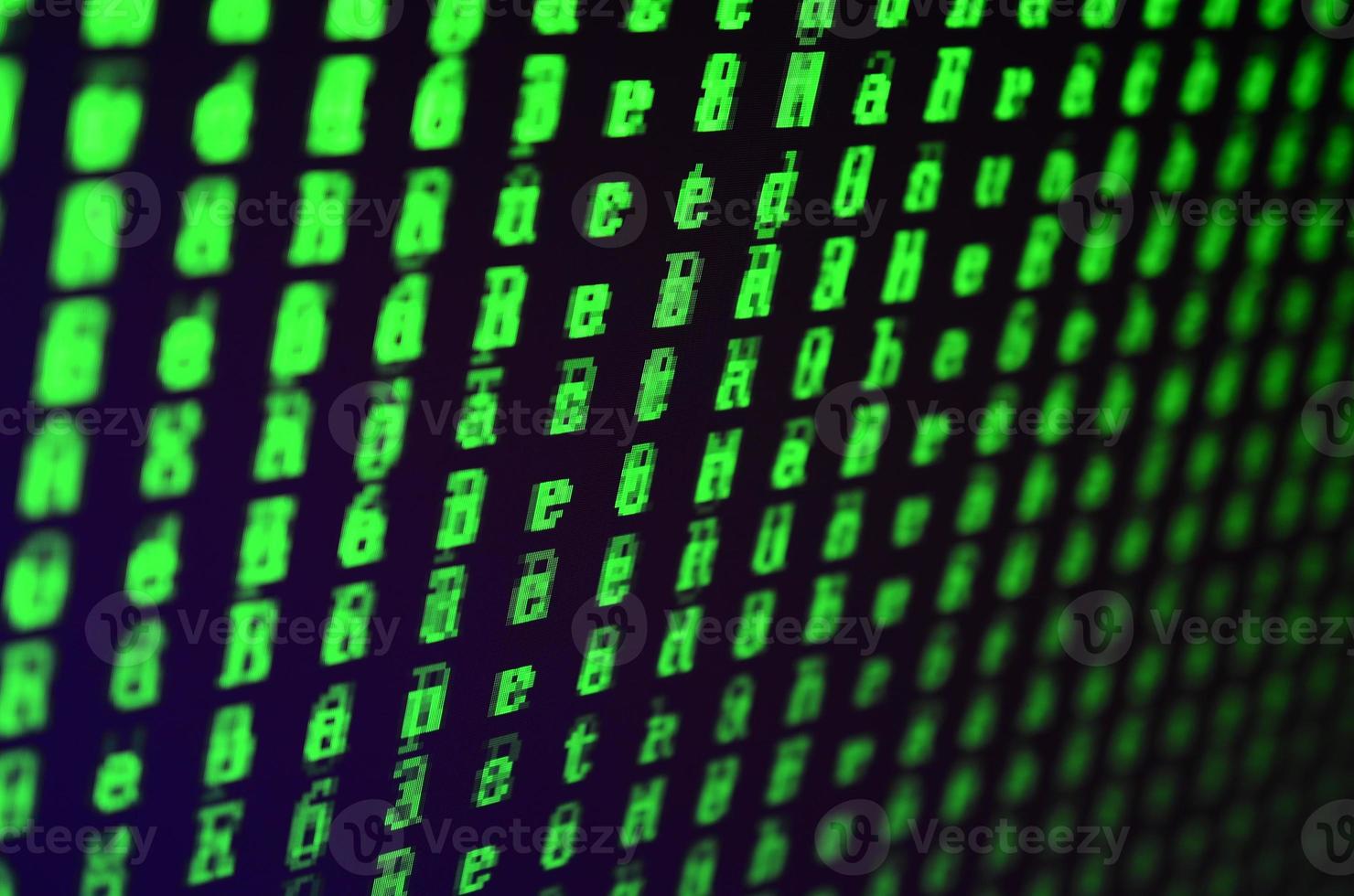 Macro shot of a glitch on the monitor of an office computer. The concept of introducing a virus into a personal data keeper. Stream of random green symbols on a black background photo