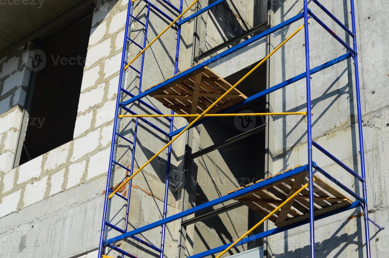 Blue and yellow construction scaffolding of a Russian building under renovation. photo