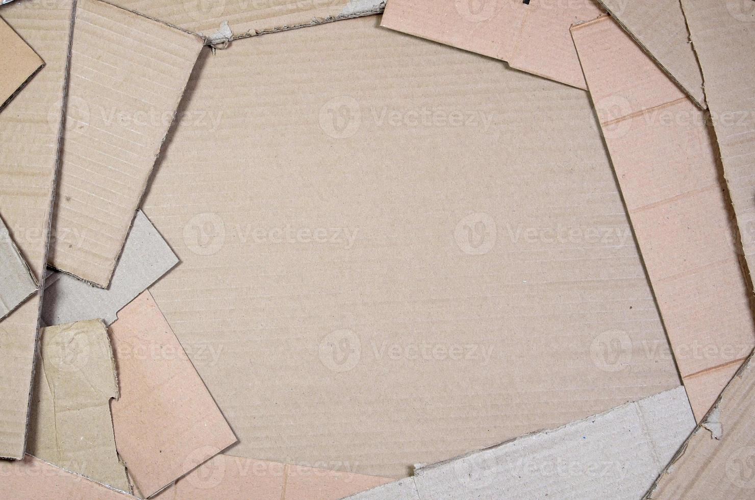 Background image with a lot of beige cardboard paper, which is used to make boxes for the transport of home appliances and postal parcels. Carton texture photo