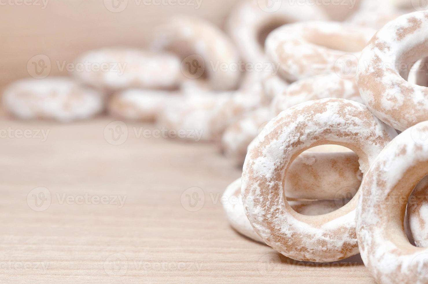 Glazed bagels on wooden table photo