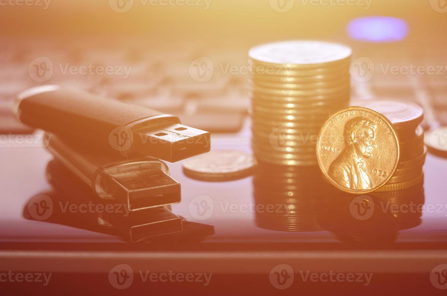 Memory cards and money on the laptop keyboard photo