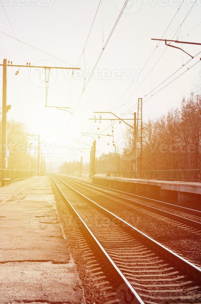 A railway station with platforms for waiting for trains photo