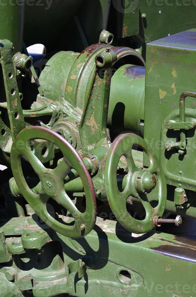 A close-up mechanism of a portable weapon of the Soviet Union of World War II, painted in a dark green color photo