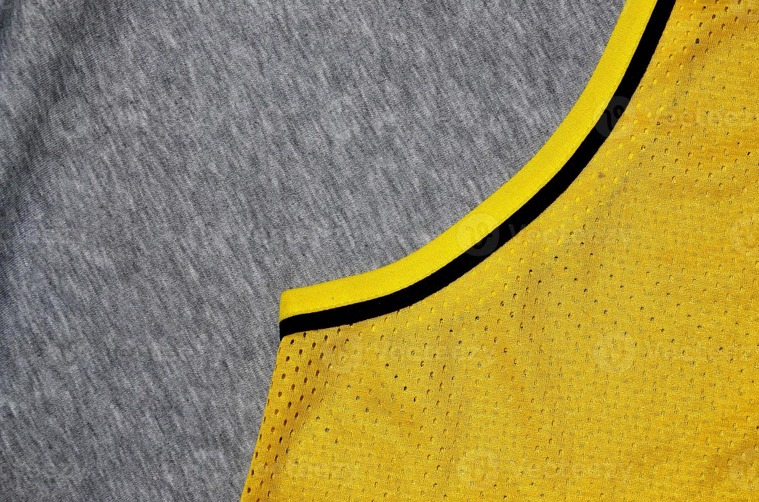 Top view of cloth textile surface. Close-up rumpled heater and knitted fabric texture with a thin striped pattern. Sport clothing fabric texture. Colored basketball shirt and heater hoodie photo