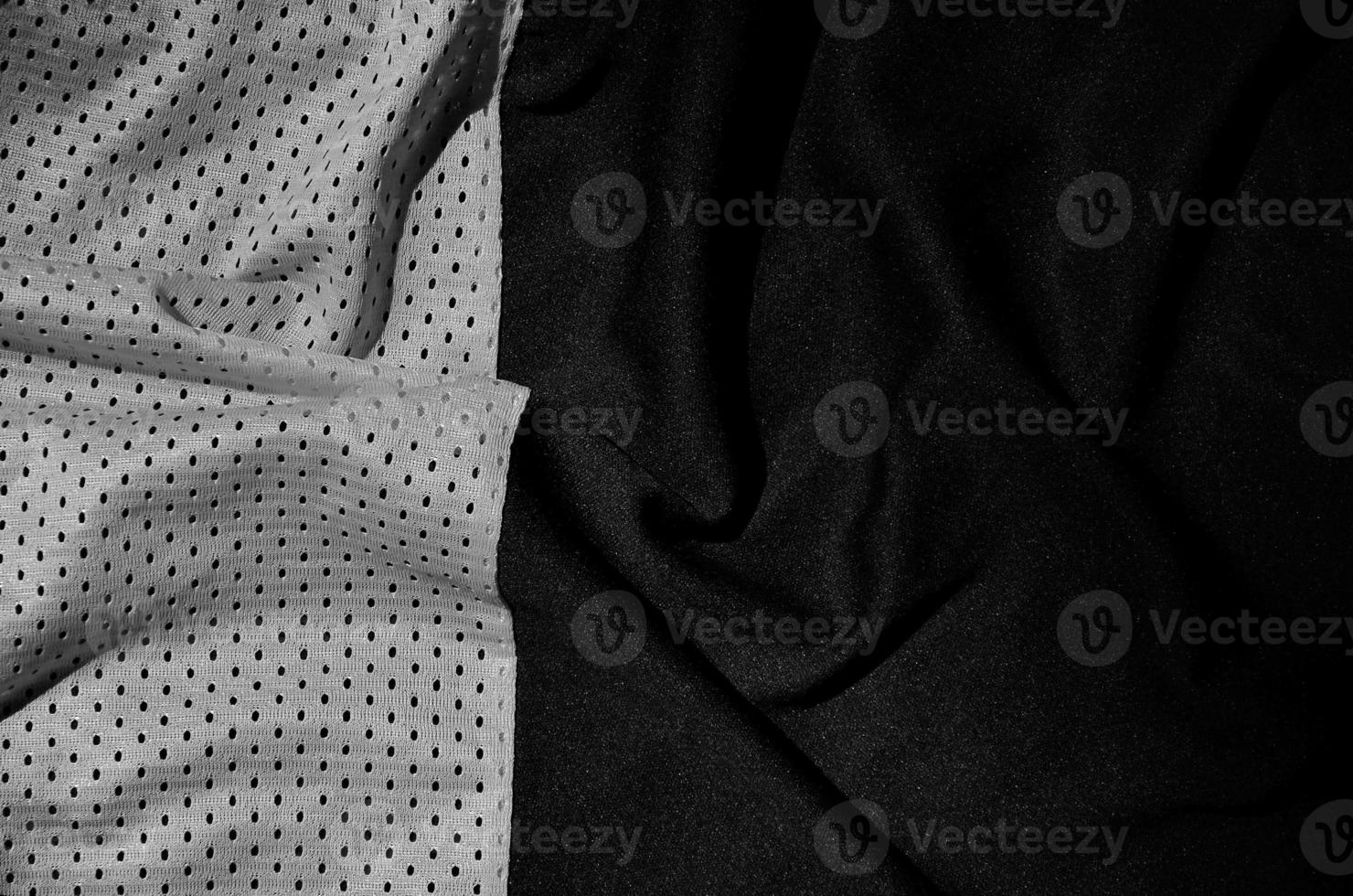 Sport clothing fabric texture background. Top view of grey polyester nylon cloth textile surface. Dark photo